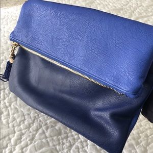 Blue fold over clutch with tassel zipper